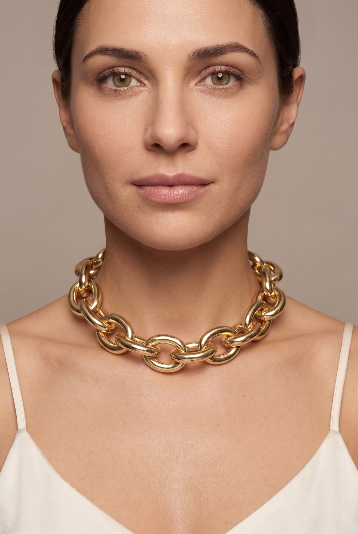 Chunky oval link chain in gold worn as a choker